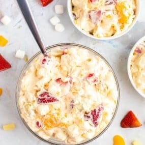 cool whip fruit salad in 3 bowls.