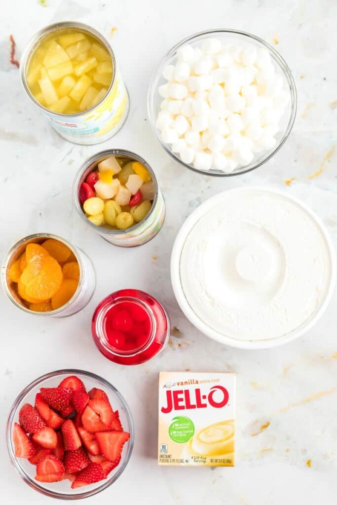 all of the ingredients needed to make fruit salad with cool whip. 