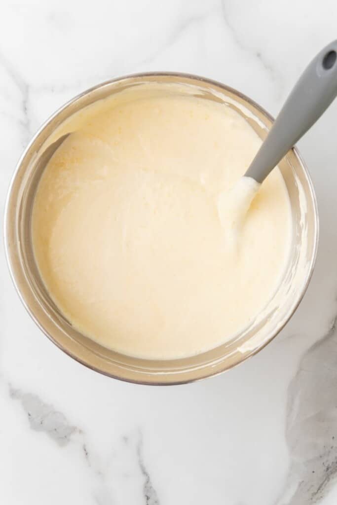 Creamy mango mousse after all ingredients are combined in a mixing bowl.