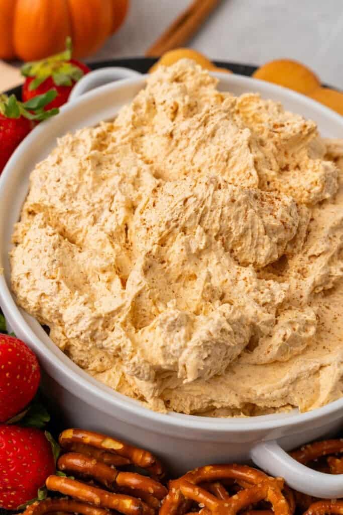 close up of pumpkin cream cheese dip in a bowl 