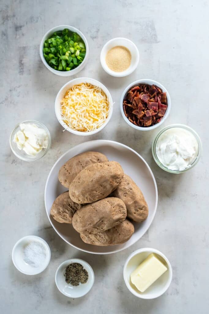 The ingredients needed to prepare twice baked mashed potatoes.