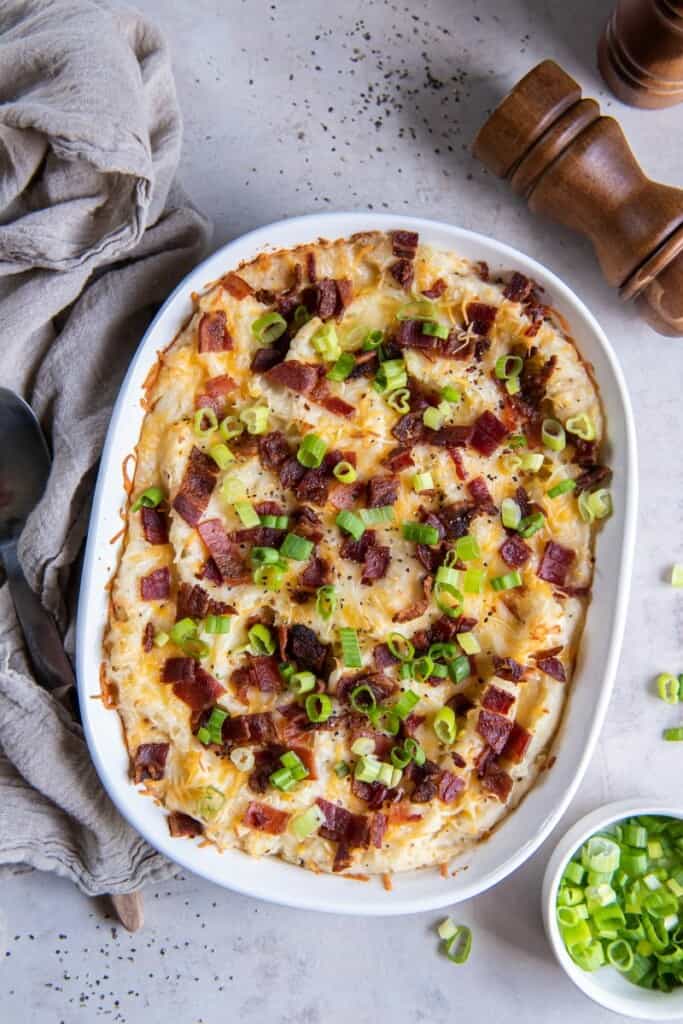 Baked twice baked mashed potatoes in a baking dish ready to be served.