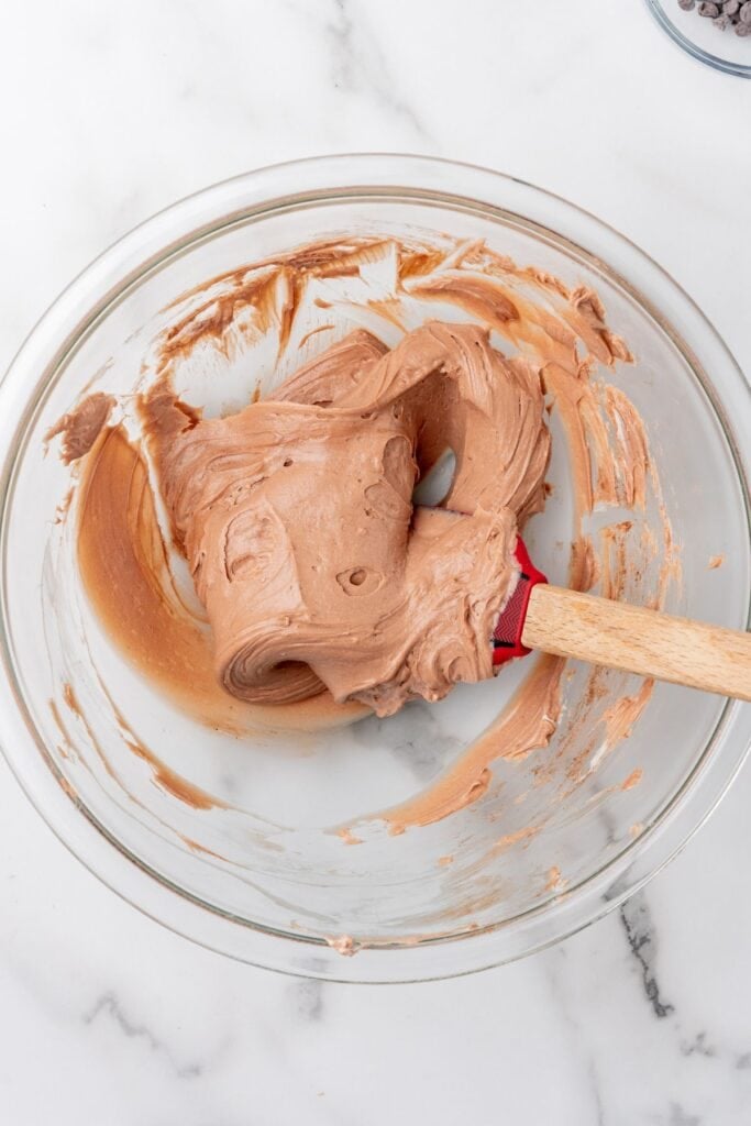 Cream cheese and hot cocoa mix mixed in a bowl to create hot chocolate dip.