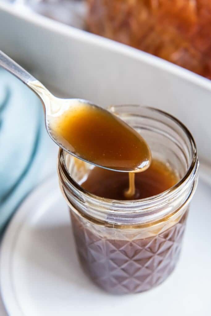 close up of ham glaze in a mason jar