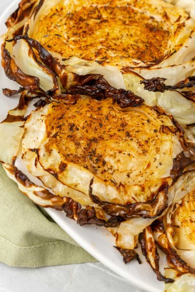 air fryer cabbage steaks on a white plate 