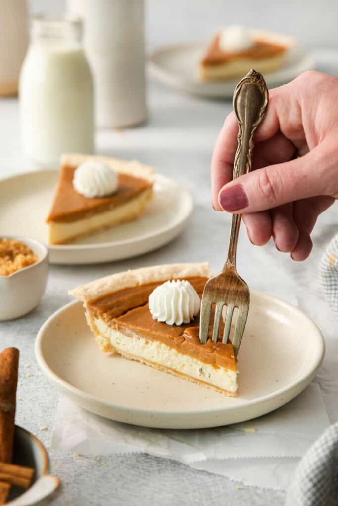 taking a bite out of layered sweet potato cheesecake pie. 