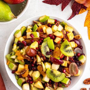 overhead shot of apple pomegranate fruit salad for the holidays.