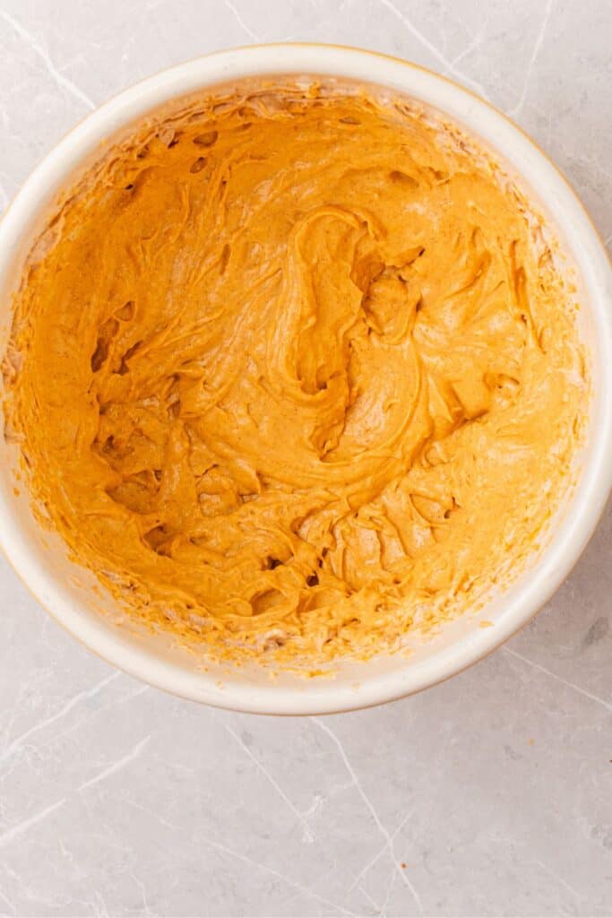 Pumpkin dip recipe with the pumpkin puree mixed into it.