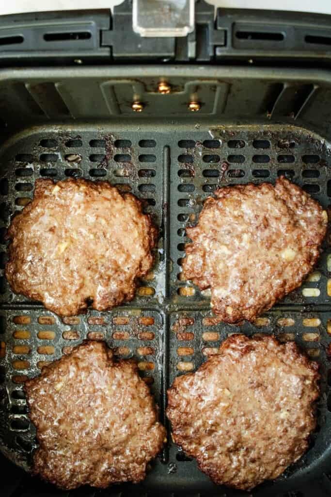 Reheated burgers in air fryer basket