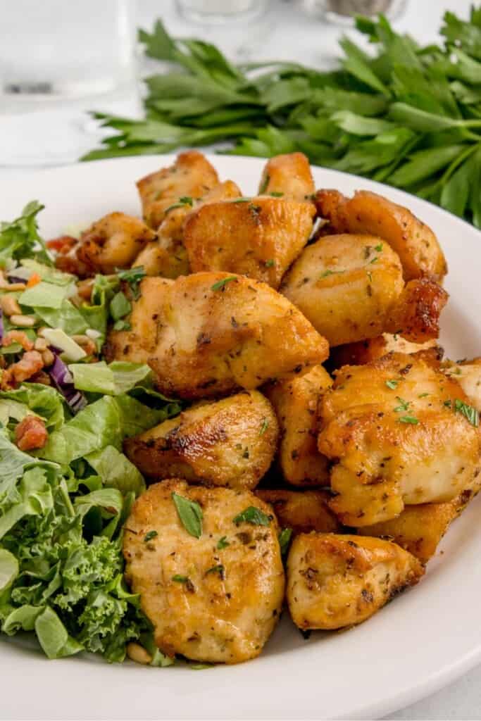 air fried chicken bites with a side salad 