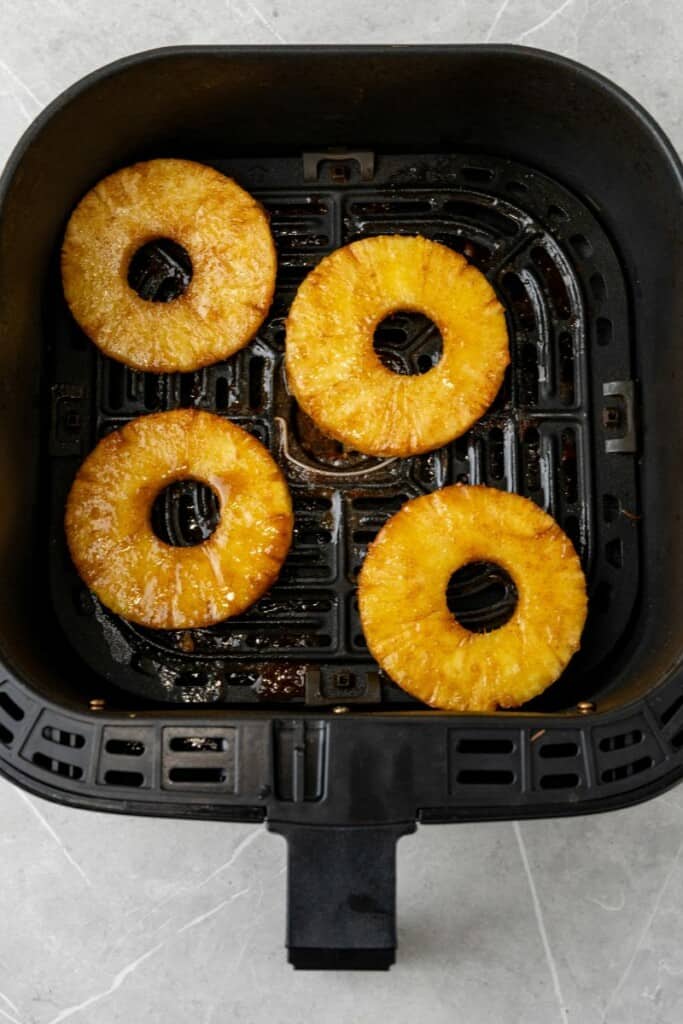 air fried pineapple in the air fryer basket 