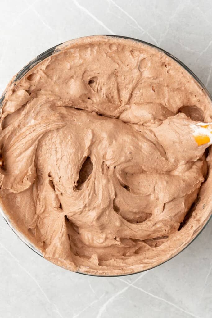 homemade chocolate whipped cream in a glass bowl 
