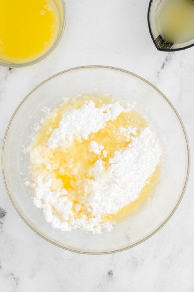 mixing together all of the ingredients needed to make pound cake icing