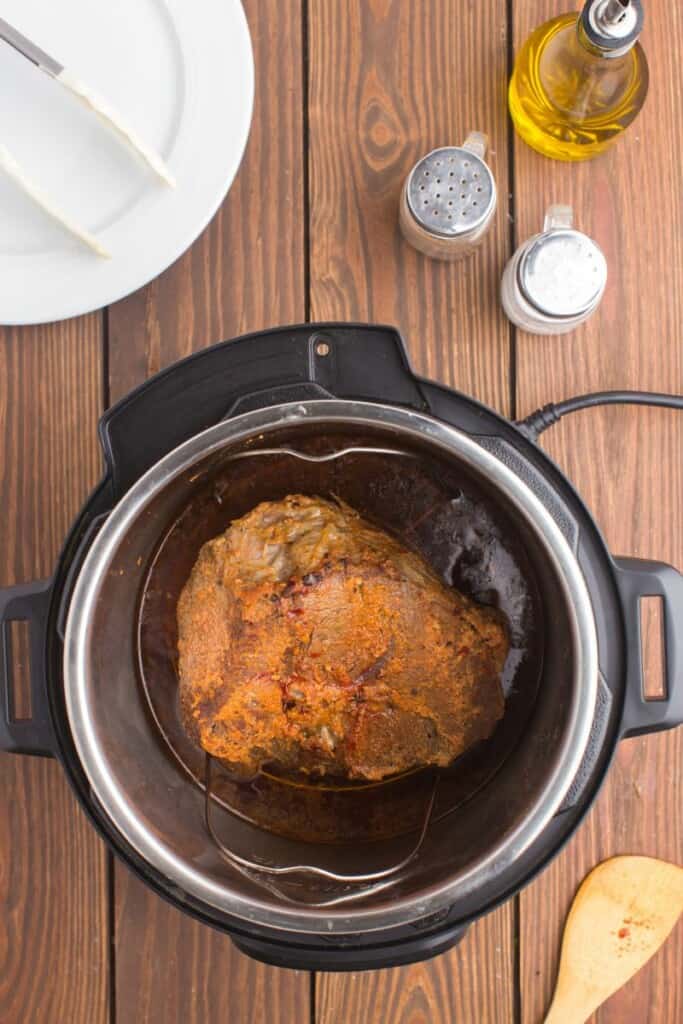 adding seared tri tip back into pressure cooker