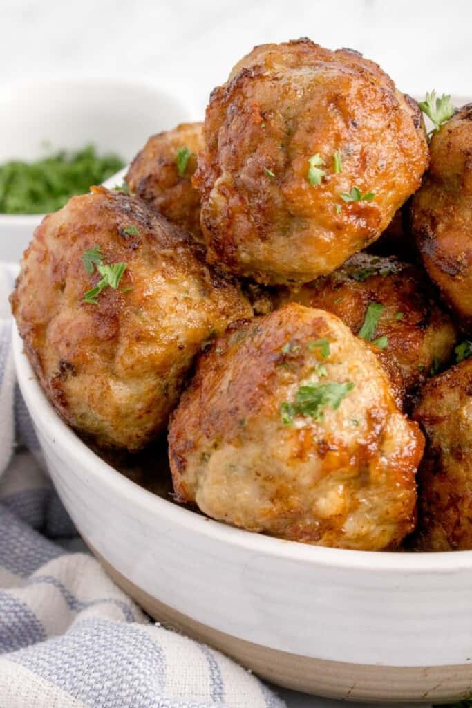 beef and cheese meatballs in a bowl 