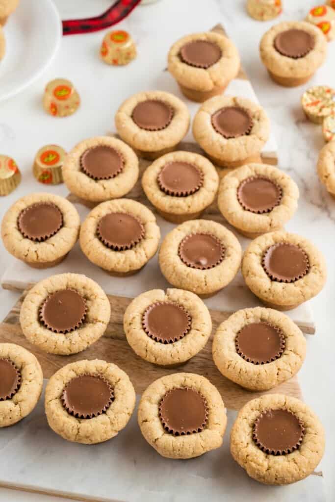 peanut butter cookies with reese's peanut butter cups shaped like a christmas tree