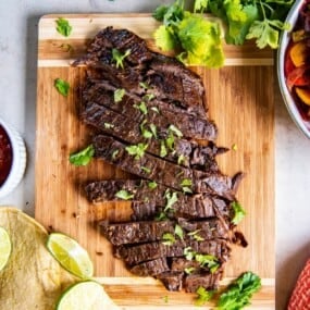 overhead shot of crock pot flank steak topped with cilantro