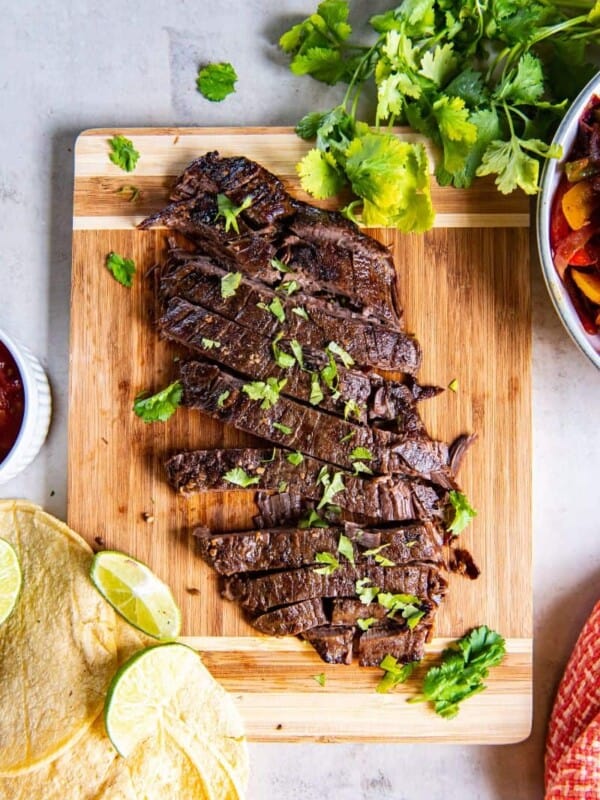 overhead shot of crock pot flank steak topped with cilantro