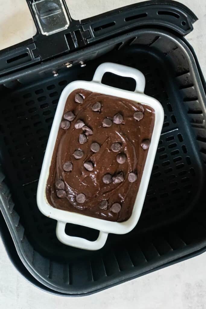 Raw brownie mix in air fryer basket