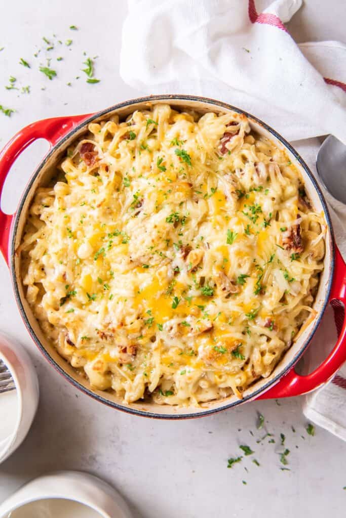Cooked bacon mac and cheese with extra cheese melted on top.