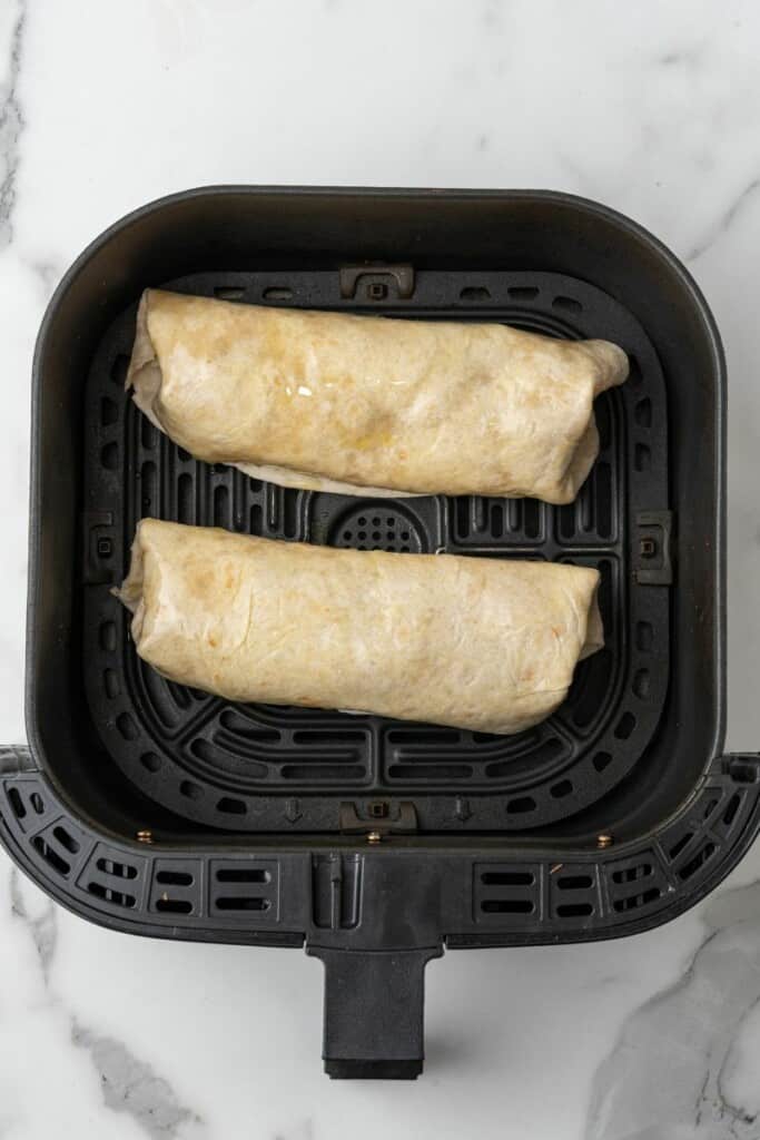 Making chicken chimichangas in an air fryer.