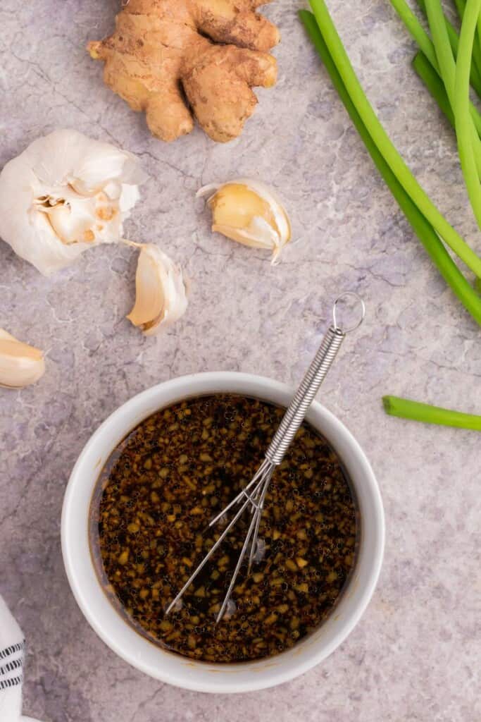 mixing together all of the pot sticker ingredients in a bowl