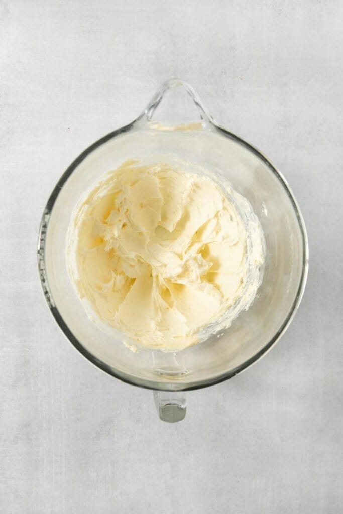 Cream cheese whipped in a mixer bowl.