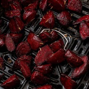 Close up of beets in an air fryer basket.