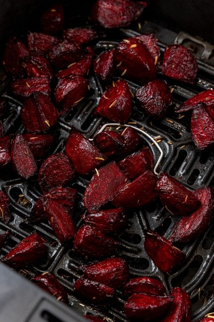 Close up of beets in an air fryer basket.