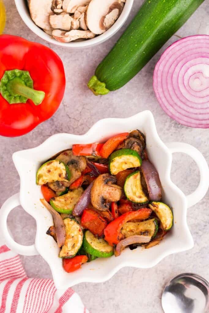 healthy cooked zucchini, peppers, mushrooms and onions