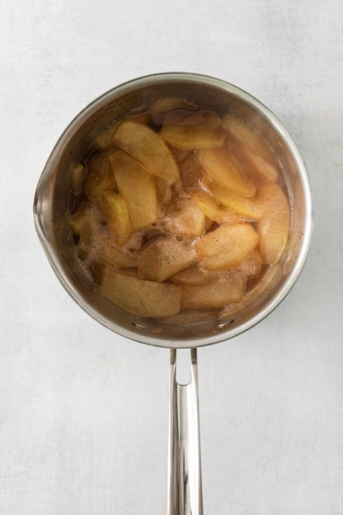 cooked cinnamon apples in a pot