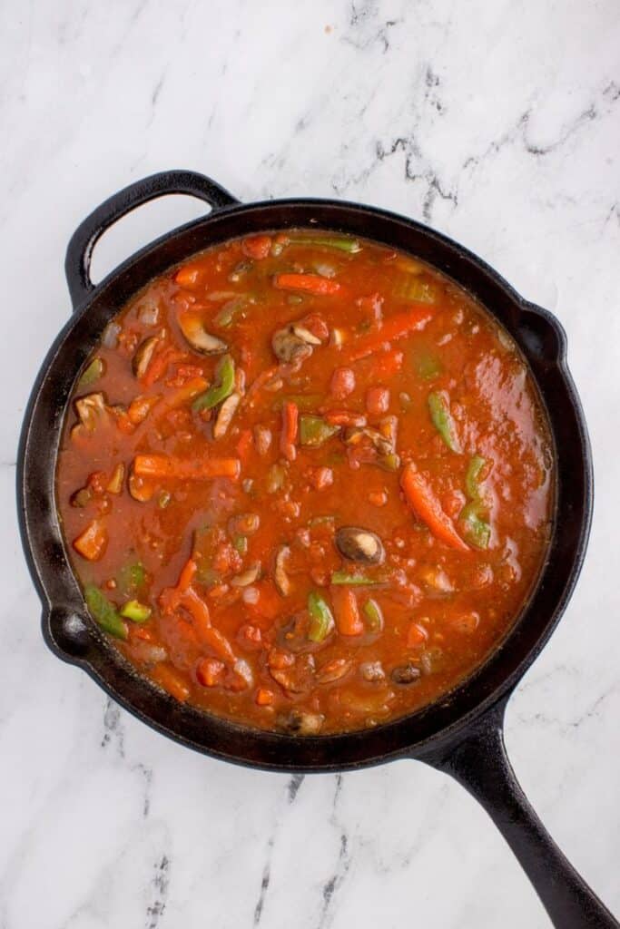 simmering veggies in tomato broth