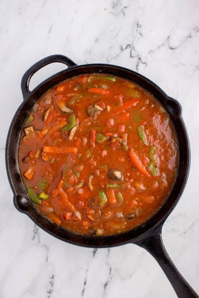 simmering veggies in tomato broth