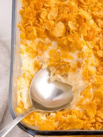 scooping up some cornflake casserole with a big spoon