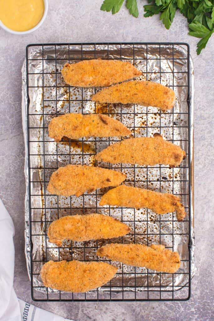 cooked chicken tenders on a wire rack