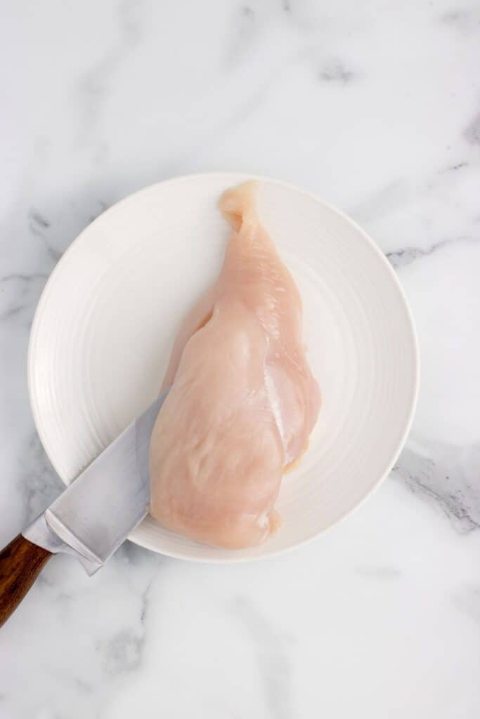 slicing a pocket into a chicken breast