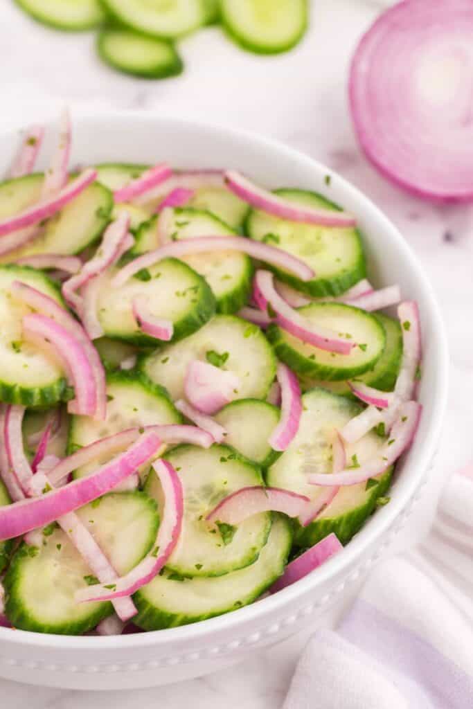 sliced red onions and english cucumbers with vinaigrette