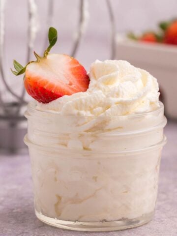 fresh homemade whipped cream in a small mason jar