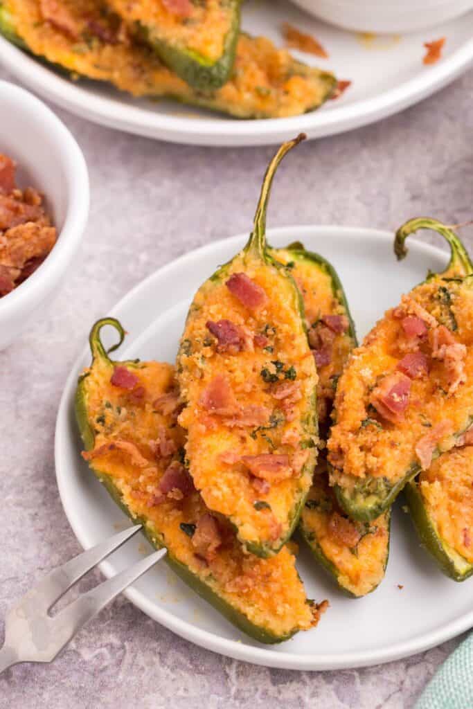 cheesy jalapeno poppers on a white platter