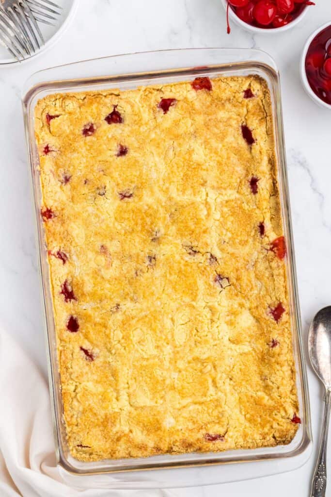 baked cherry cobble dump cake in a baking dish 