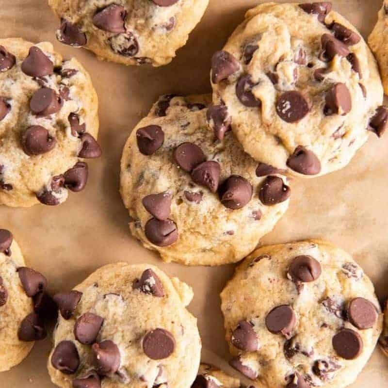 several chocolate chip cookies on parchment paper