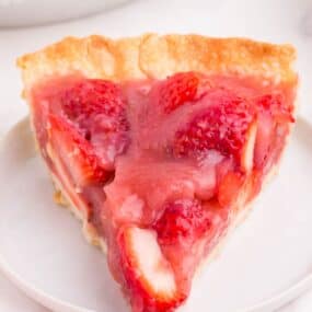 a close up of strawberry pie slice