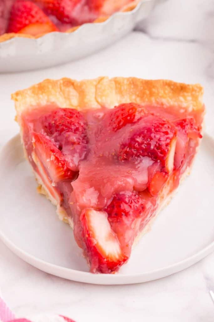a close up of strawberry pie slice