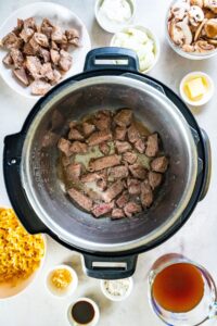 Stew meat being seared in instant pot