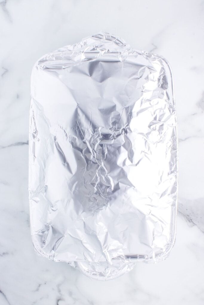 covering pork shoulder with aluminum foil to cook in the oven 
