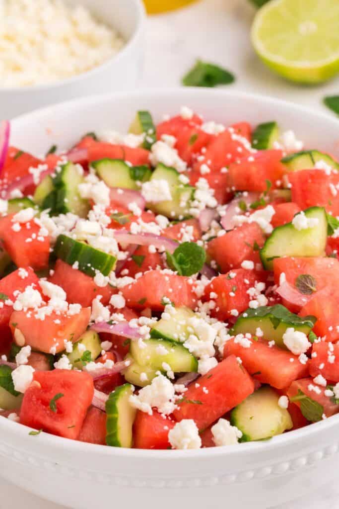 close up of watermelon feta salad recipe in a white bowl 