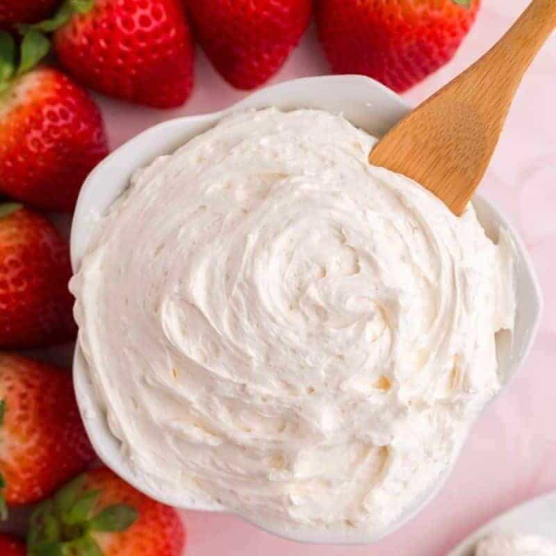 cool whip fruit dip in bowl with serving spoon