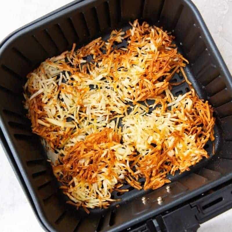 flip hash browns in air fryer halfway to cook evenly on both sides