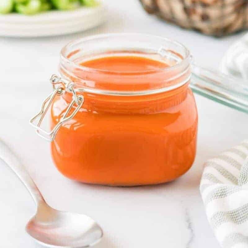 Buffalo sauce stored in a mason jar