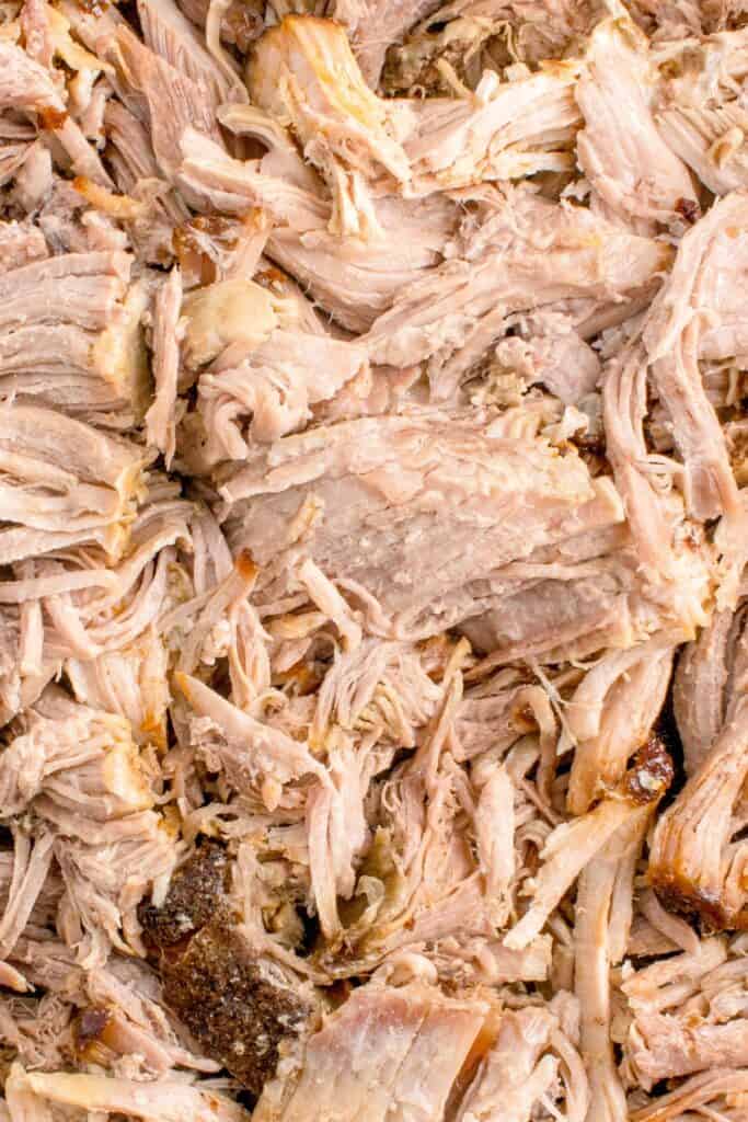 Close up of oven pulled pork after it's been shredded.